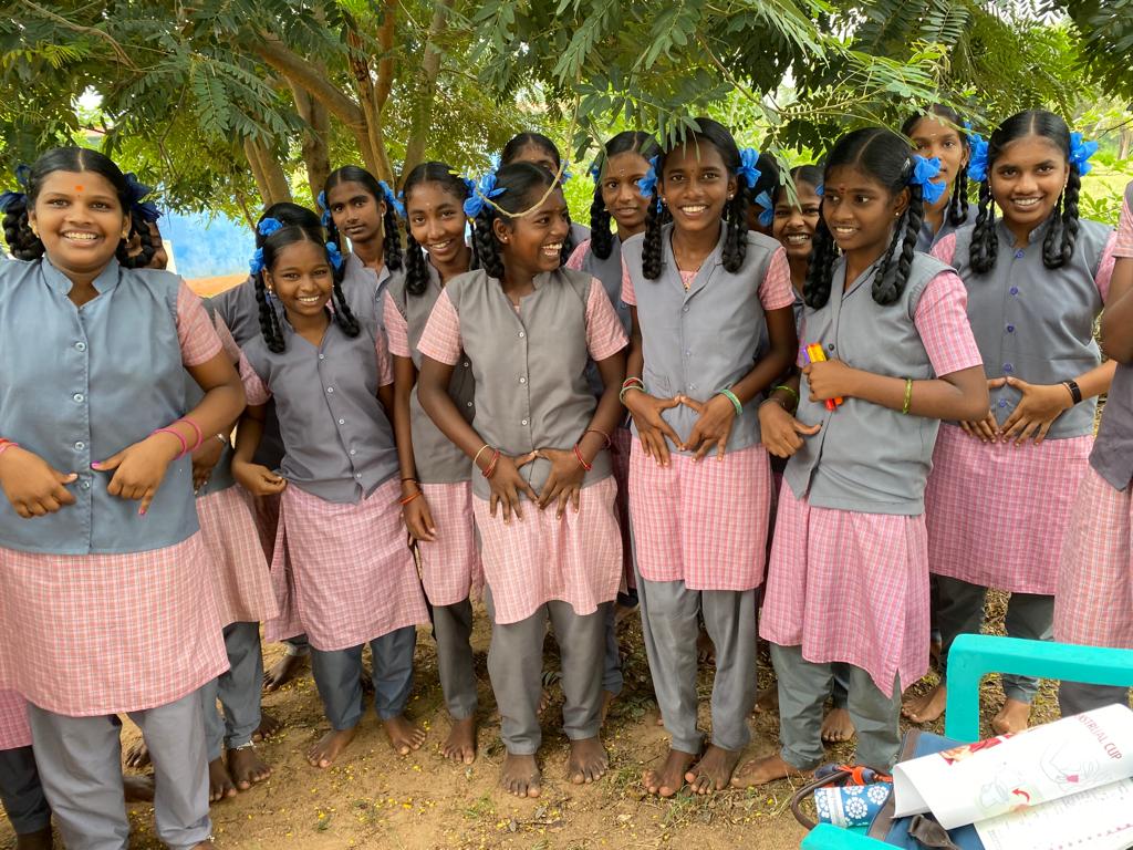 school girls showing where the uterus is